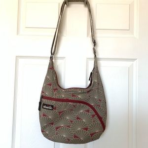 Kavu:  Maroon and tan cross-body canvas sling bag
